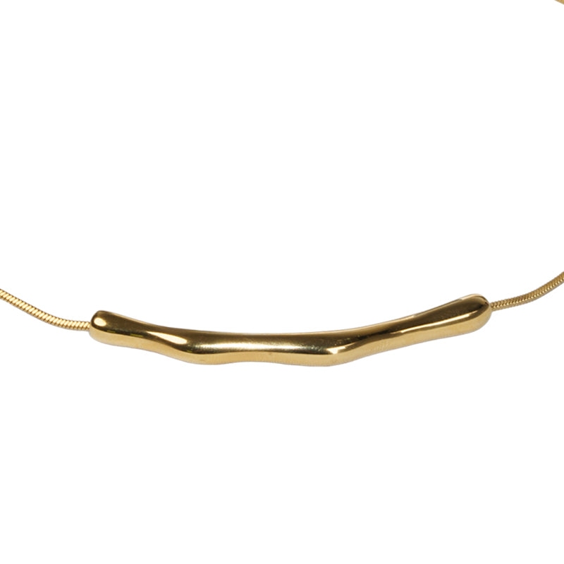 Gatsby Necklace, an 18K gold plated stainless steel necklace with a smooth curved bar pendant on a snake chain.
