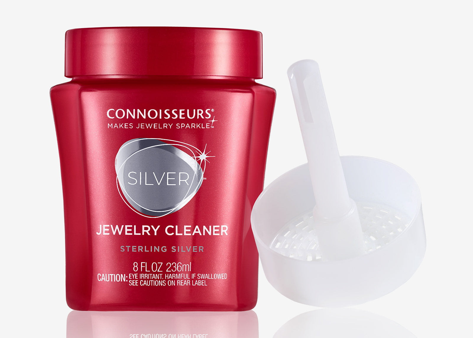 Connoisseurs Sterling Silver Jewelry Cleaner in red jar with white cleaning basket and brush attachment