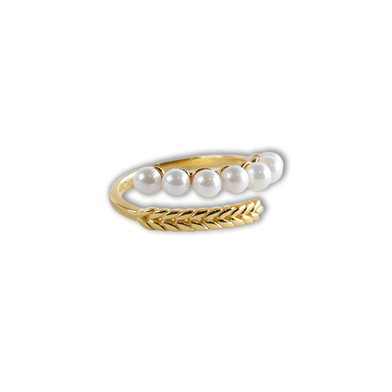 18K gold plated 925 silver ring with a row of white pearls and a textured wheat pattern band, shown at an angle.