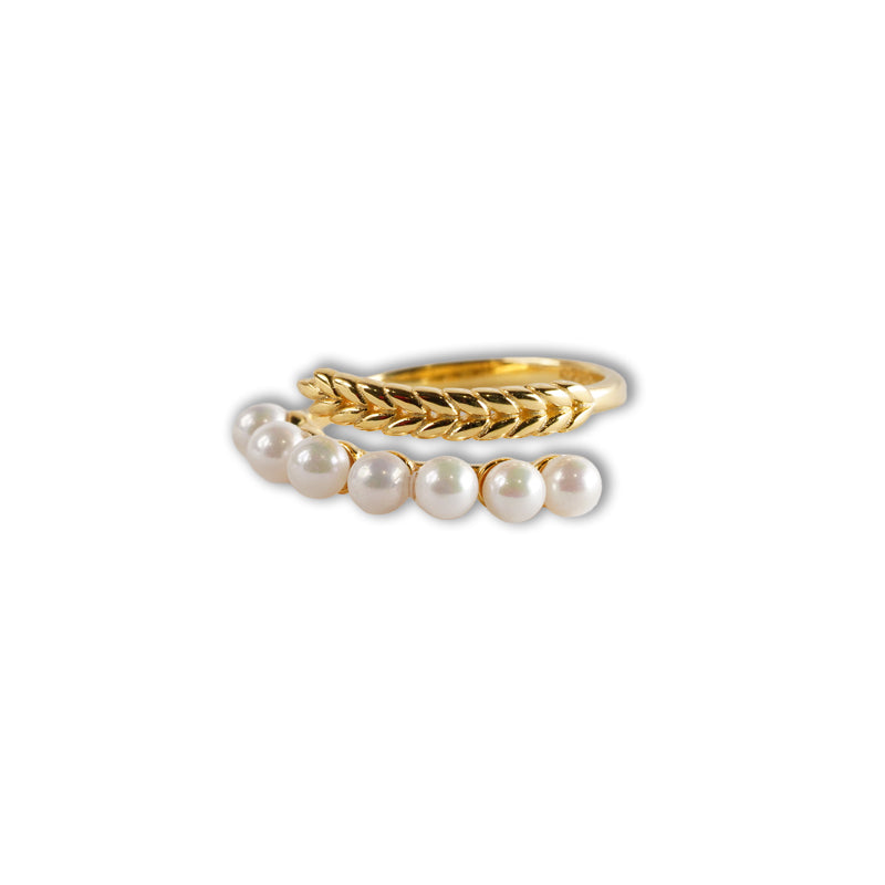 Pearlflow Ring, an 18K gold plated 925 silver ring with textured band and curved pearl strand, shown at an angle.