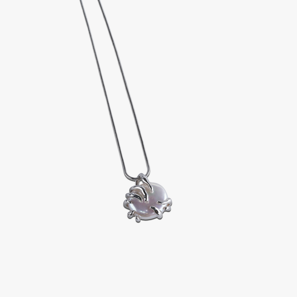 # Calypso Pearl Necklace-Silver featuring 925 silver plated dolphin pendant with pale purple pearl stone.