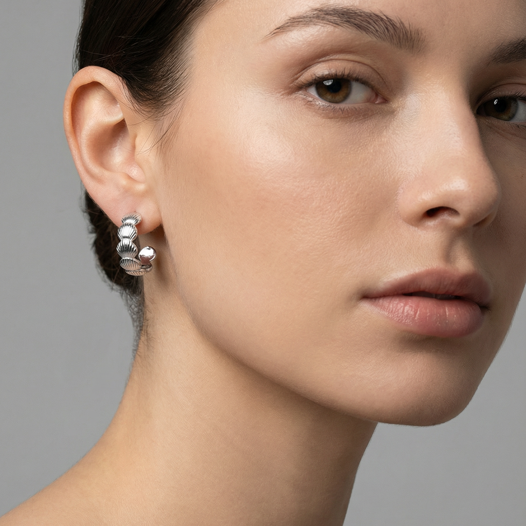 Isla Hoops-Silver 925 sterling silver earrings with textured shell-like design and smooth silver spheres.