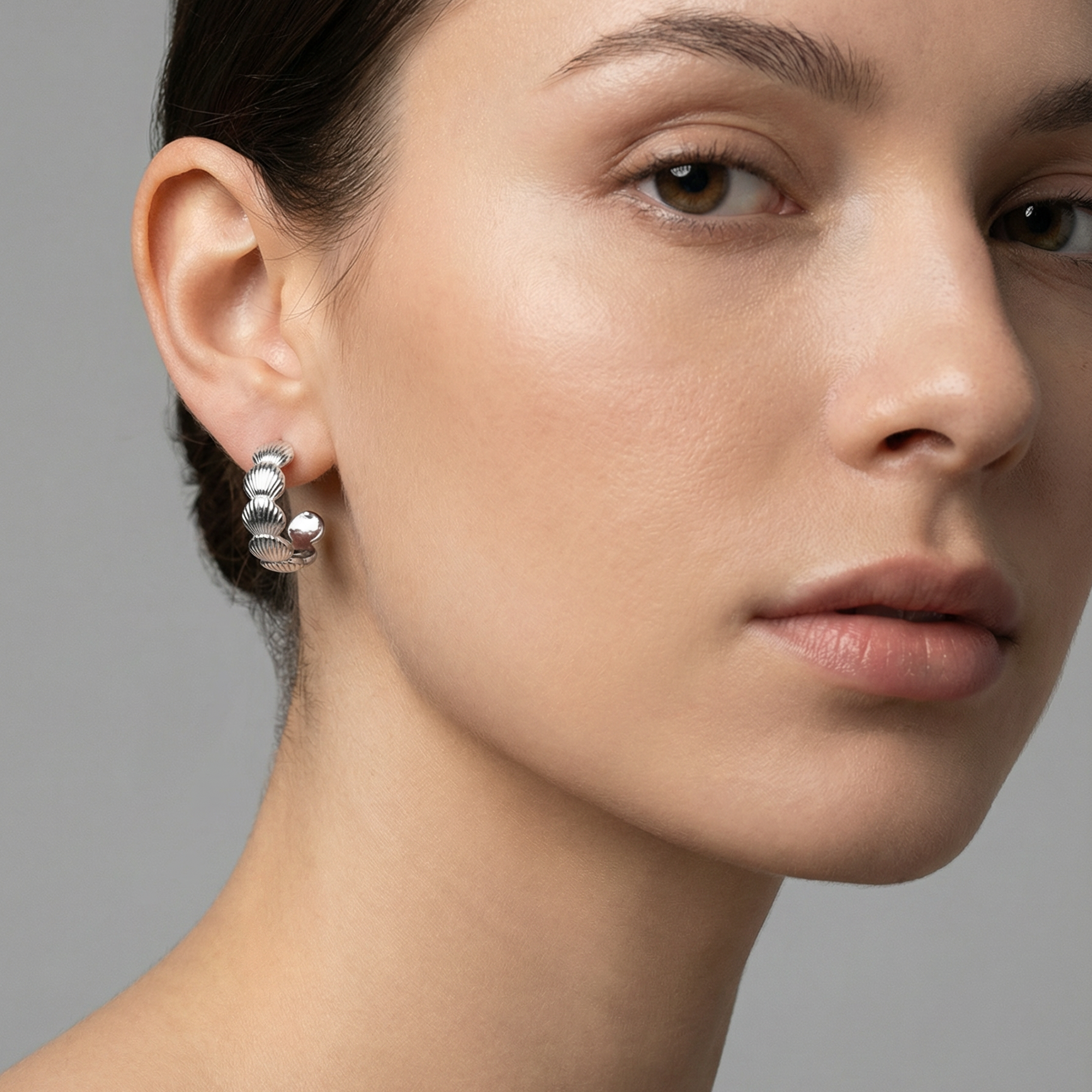 Isla Hoops-Silver 925 sterling silver earrings with textured shell-like design and smooth silver spheres.