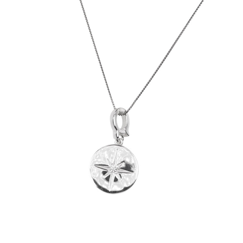 Stella Necklace, a 925 silver necklace with a sand dollar pendant, shown hanging on a delicate chain.