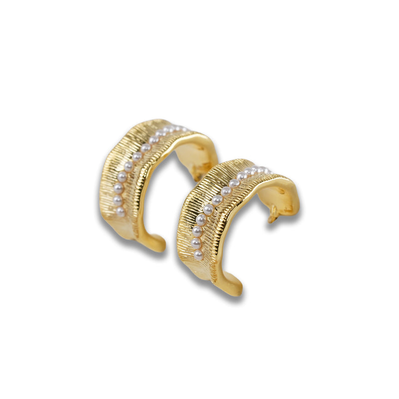 Lucian Earrings- Gold, an 18K gold plated 925 silver earring pair with textured bands and crystal accents, shown at an angle.