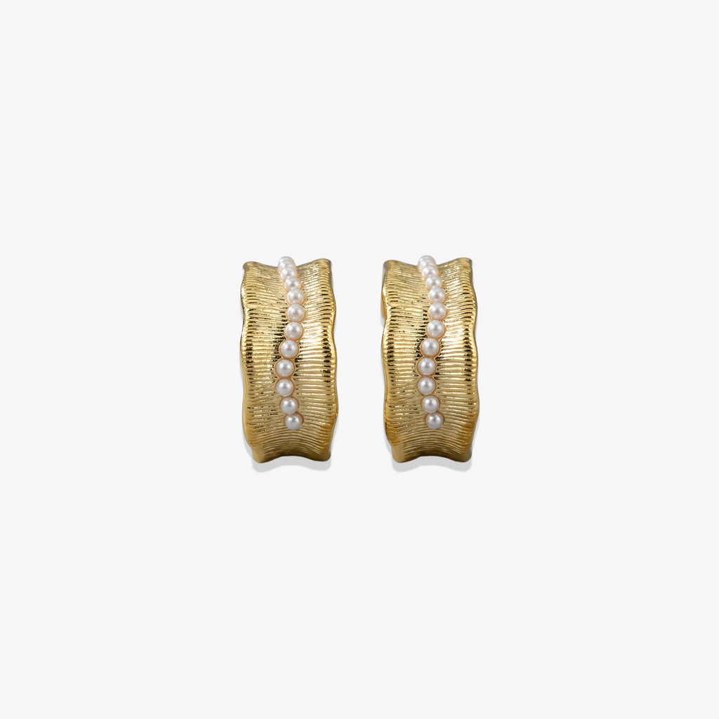 Gold-plated 925 silver Lucian earrings with textured finish and pearl embellishments in curved design.