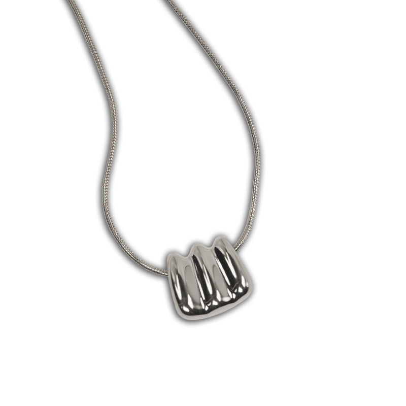 Silver Ripple Necklace, a 925 silver necklace with a wavy ridged pendant, shown hanging at an angle.
