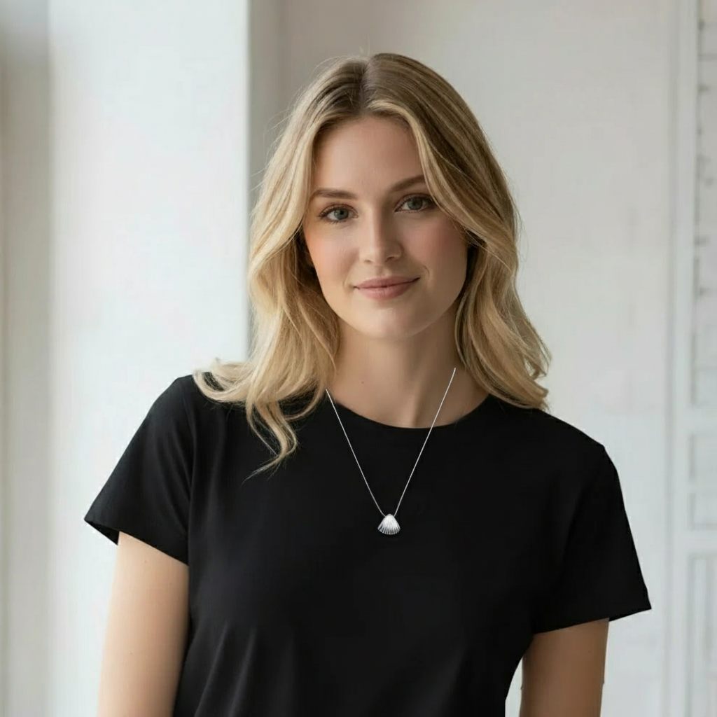 Aurora Shell Necklace, a 925 silver necklace, shown worn on a model with a black shirt.