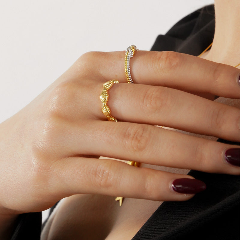 Sailor Rope Ring, a 925 silver ring with textured rope design, shown on a model's hand wearing multiple rings.