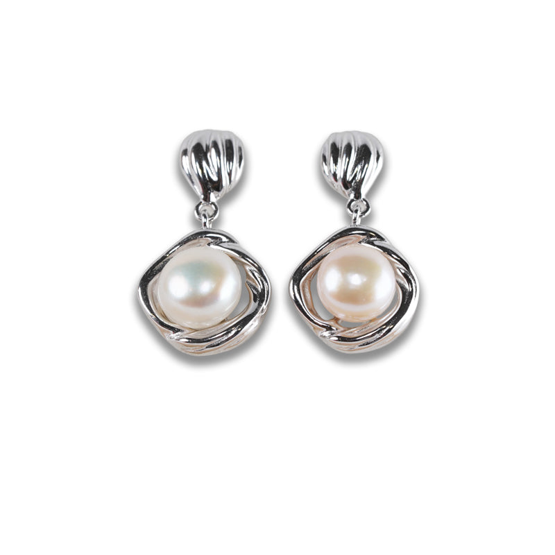 Bianca Earrings, a 925 silver earring with textured teardrop studs and dangling pearl settings, shown from the front.