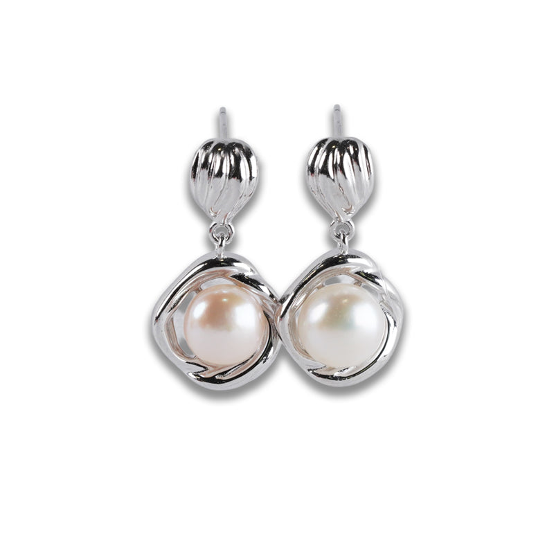 Bianca Earrings, a 925 silver pair featuring textured dome studs with dangling twisted settings holding white pearls, shown flat lay.