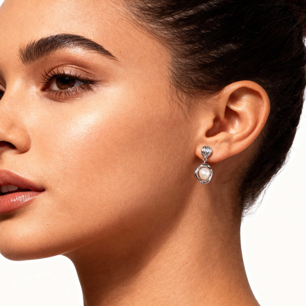 Woman wearing Bianca Earrings, 925 silver drop earrings with pearl center stone, silver plated.
