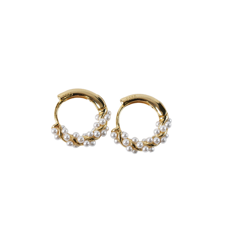 Sea Whisper Earrings, 14K gold plated 925 silver hoop earrings with small pearls clustered along the bottom half, shown flat.