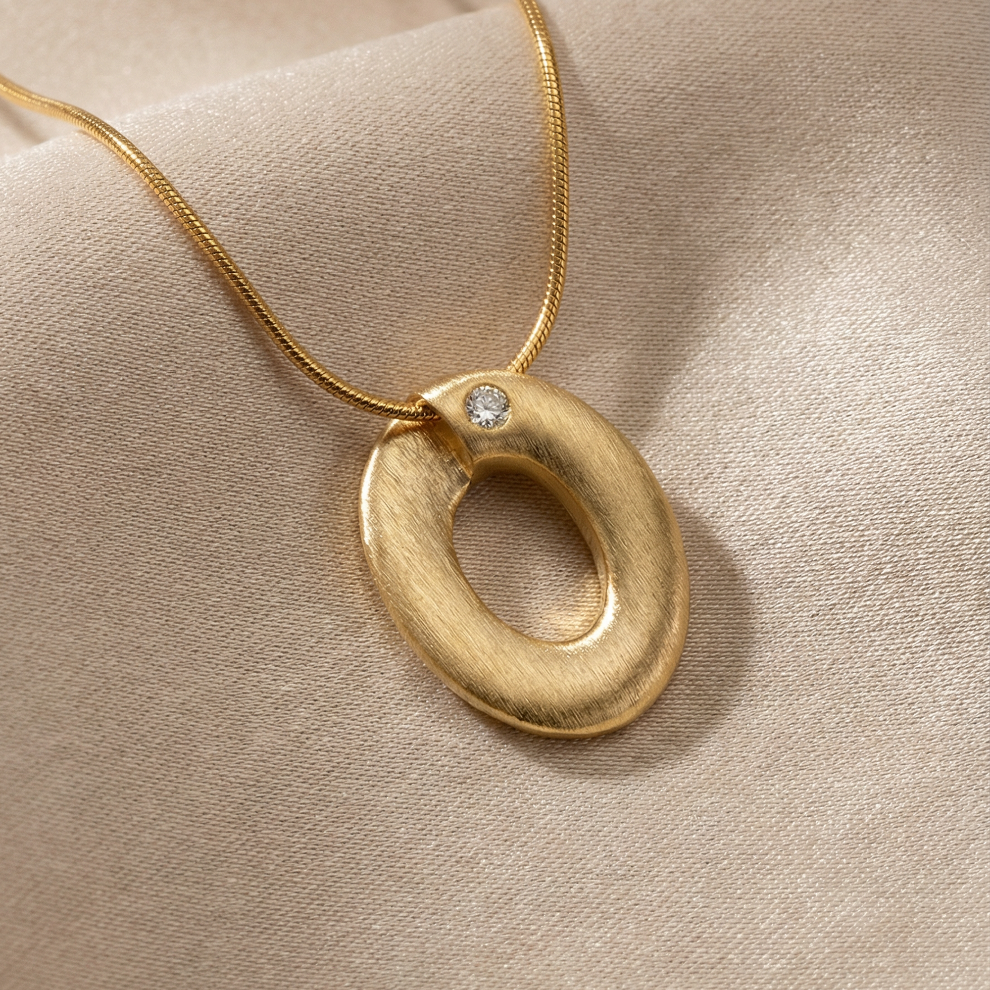 Gold plated oval pendant necklace with single crystal stone on snake chain - Ophelia Necklace Gold