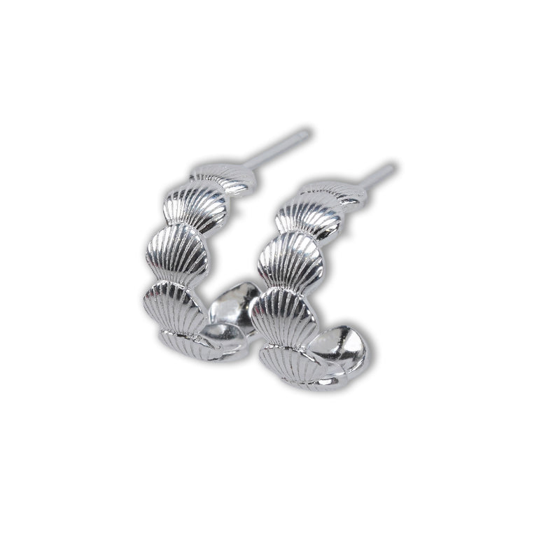Isla Hoops-Silver, a 925 silver earring featuring three graduated scallop shell designs forming a hoop, shown as a pair.