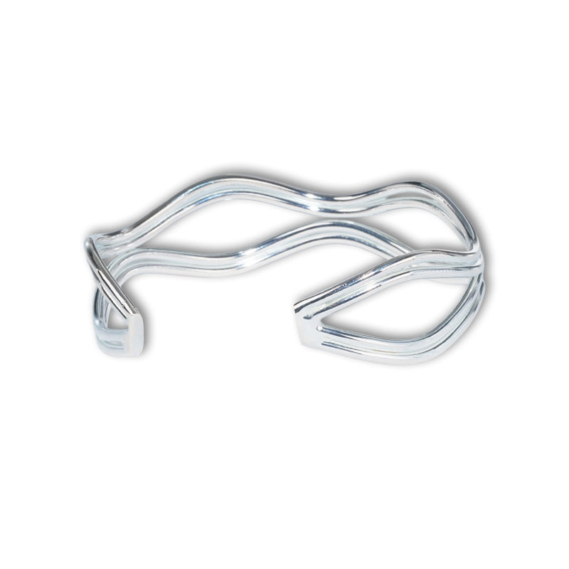 Valentina Bangle- Silver, a 925 silver bangle with flowing wave-like design, shown at an angle.